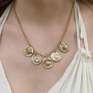 gold necklace with 5 disks of blister pearls