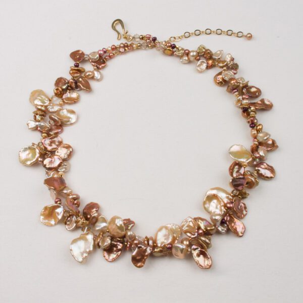 A necklace with many small pearls on it