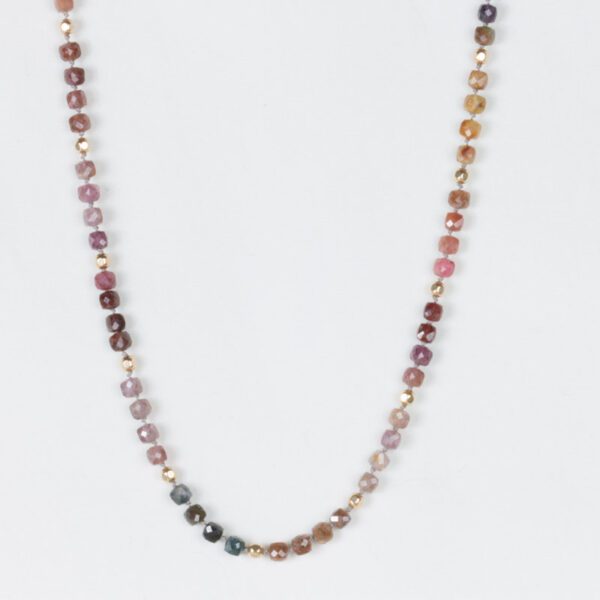 A long necklace with many different colored beads.