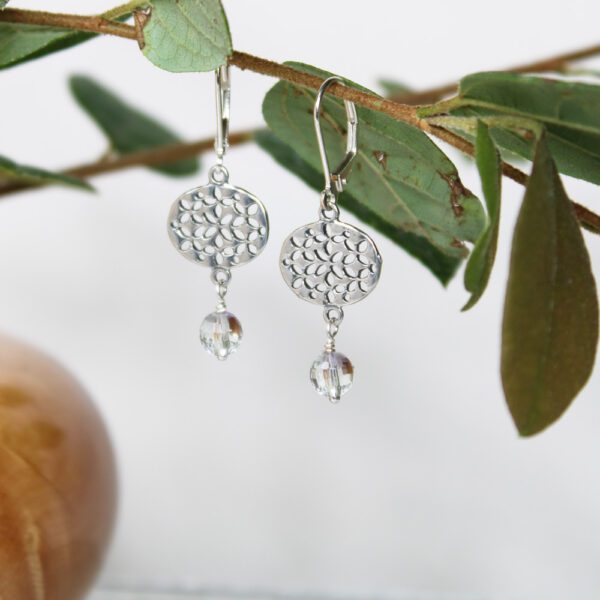 Small sideways oval SS earrings with cut out design and clear bead drop