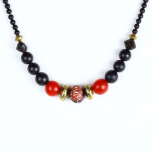 A necklace with black and red beads on it.