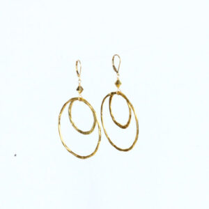 A pair of gold earrings with two circles.